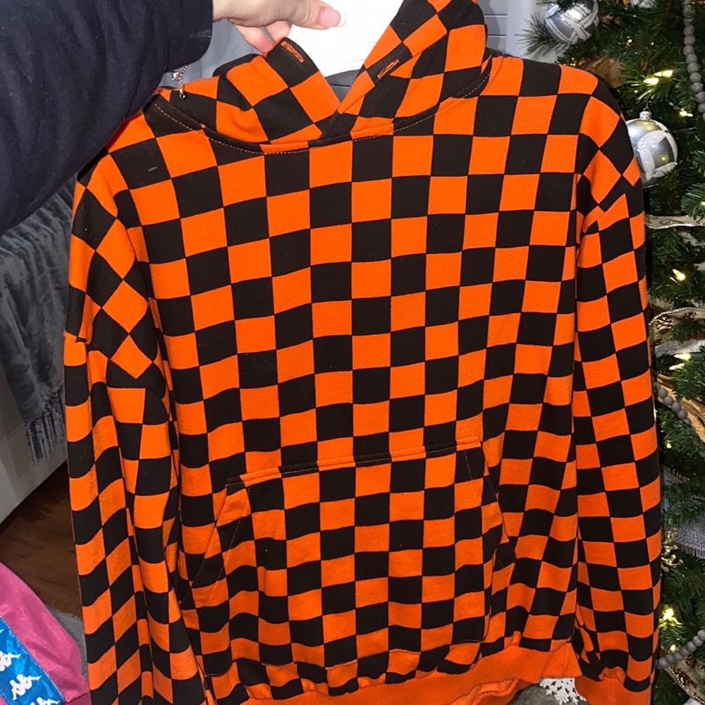 Orange and black checked sweater